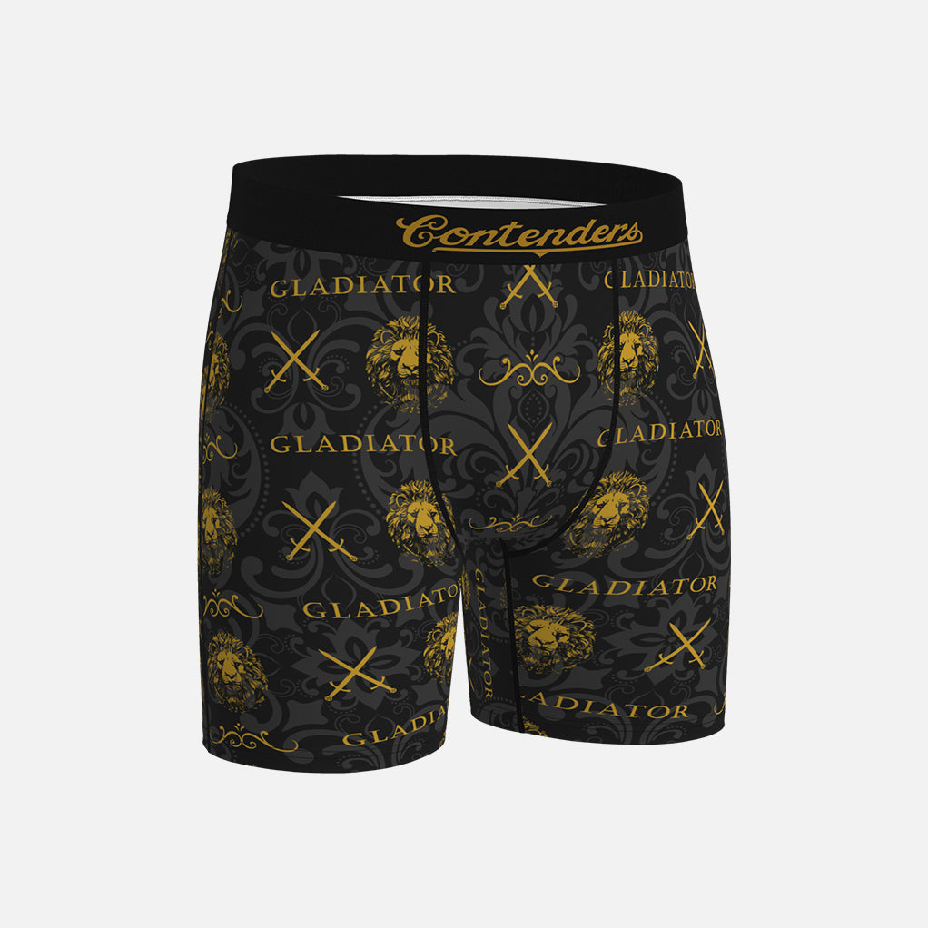 Black boxer briefs with gold 'Gladiator' and 'Contenders' branding on a light gray background