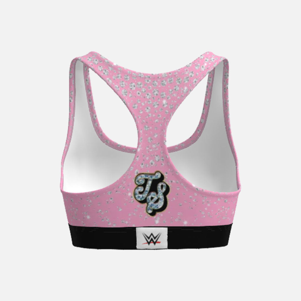 Pink sports bra with floral pattern and WWE logo on a white background