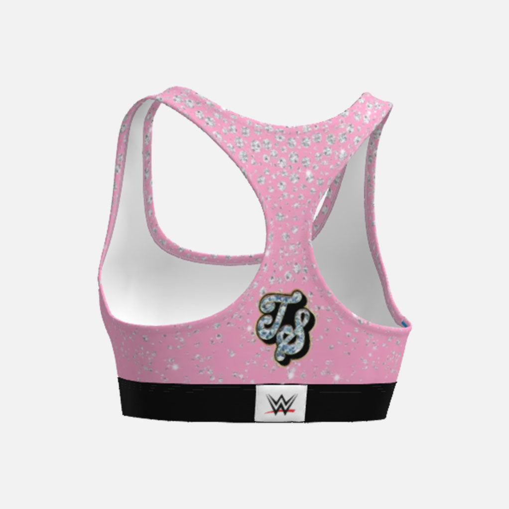 Pink sports bra with floral pattern and WWE logo on a white background