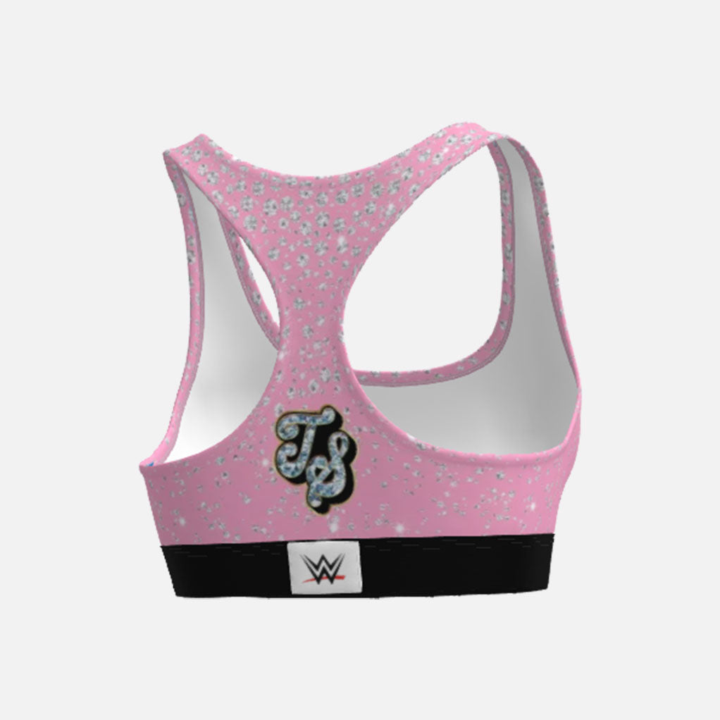 Pink sports bra with floral pattern and WWE logo on a white background